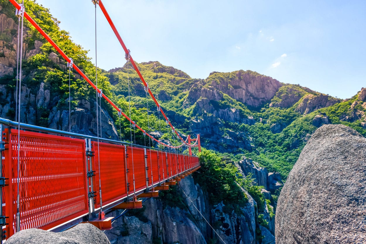 Guide to hiking the Wolchulsan National Park in South Korea. Check out the famous Cloud Bridge that links the two peaks of this National Park. #travel #hiking