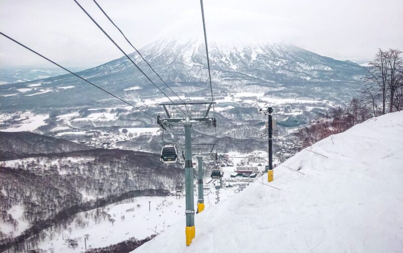 Plan your ski trip to Niseko, Japan. Learn about what to expect at the resort, and where to dine, drink and stay in the Hirafu area. #japan #ski #travel