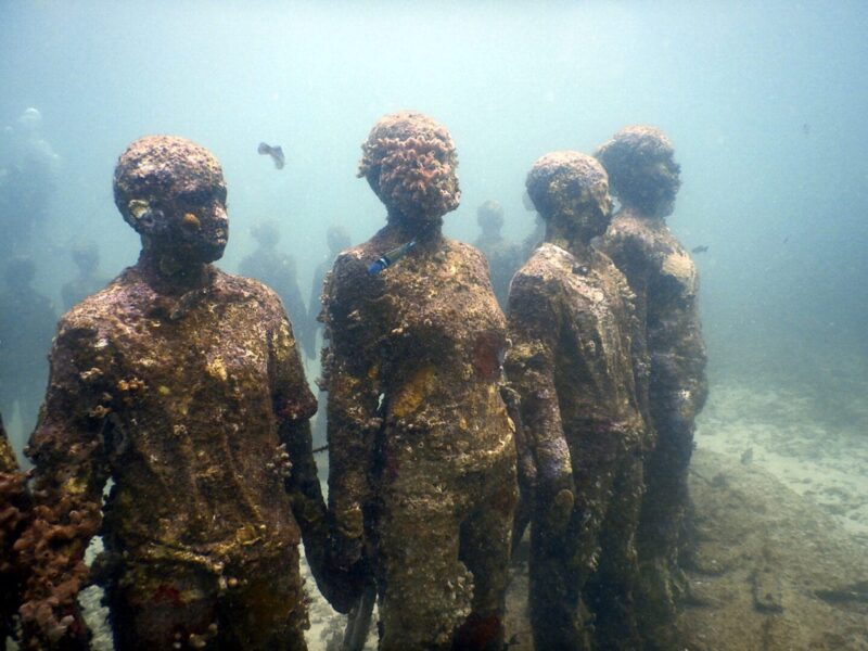 Molinere Underwater Sculpture Park, located off the coast of Grenada, is a captivating and unique dive site renowned for its underwater art gallery. Created by British sculptor Jason deCaires Taylor, this submerged sculpture park features a collection of over 65 life-size sculptures positioned on the ocean floor. The sculptures, made from environmentally friendly materials, serve as an artificial reef, encouraging marine life to thrive and providing a visually stunning and surreal experience for divers.