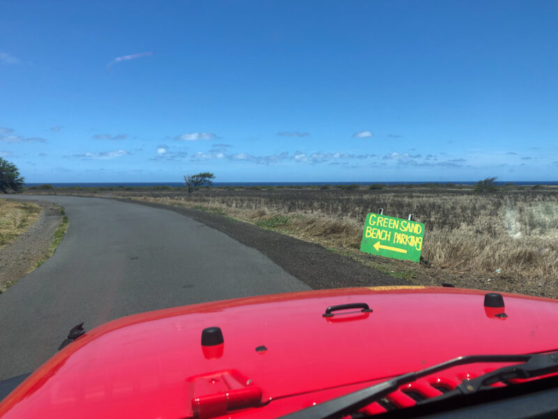 Want to learn about hiking to Green Beach on the Big Island, Hawaii? Read about what to expect during the 6 mile round trip hike, from parking, conditions, to about the green beach scam! #greenbeach #hawaii #hike