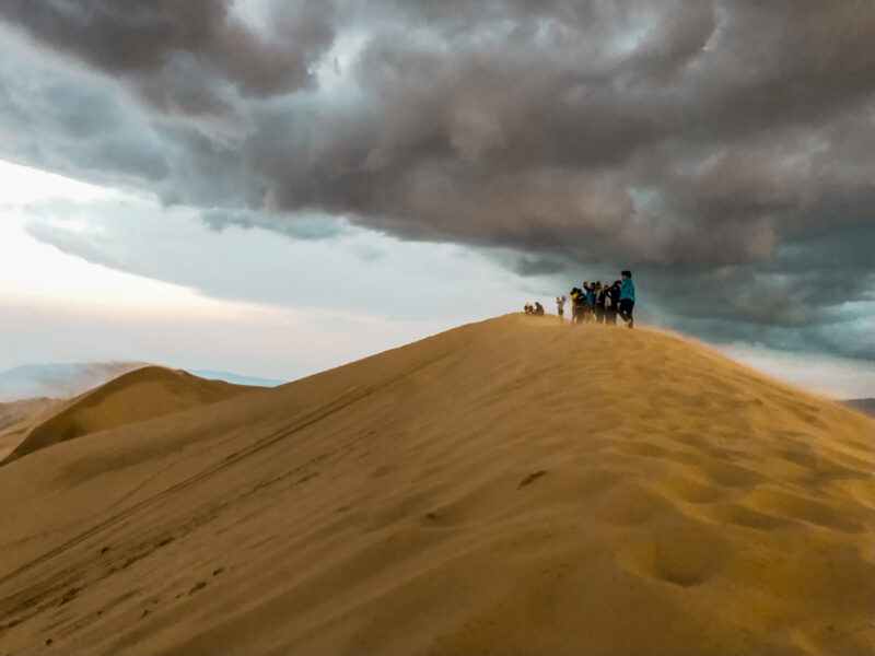 The peak of the Khongor Sand Dunes. The Gobi in Mongolia is famous for the sand dunes. Therefore climbing the Khongor Sand Dunes is a must-do for any visitor to the Gobi! Learn about what to expect in summiting the great sand dunes. #sanddunes #mongolia #khongorsanddunes