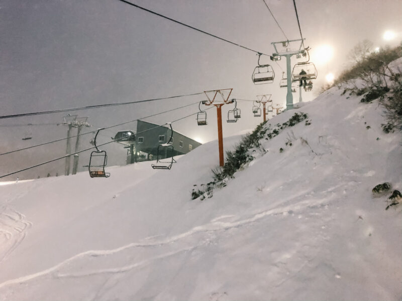 Some fresh powder under the chair lifts while night skiing at NIseko.