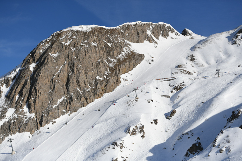 Embracing the thrill of solo skiing in Ischgl, carving through the powdery slopes with a sense of freedom and exhilaration against the breathtaking Tyrolean mountain landscape.