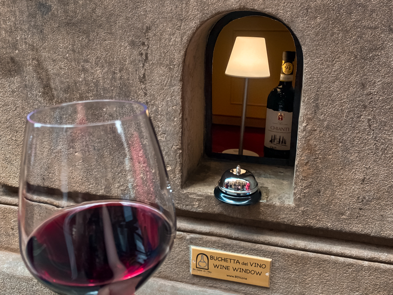 Discovering History: Exploring Florence's wine windows, like this one nestled in Santo Spirito, unveils the city's ingenious response to the Black Death in the 16th century.